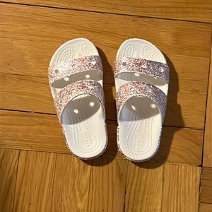 Used Crocs kids multi-color slippers size 11.